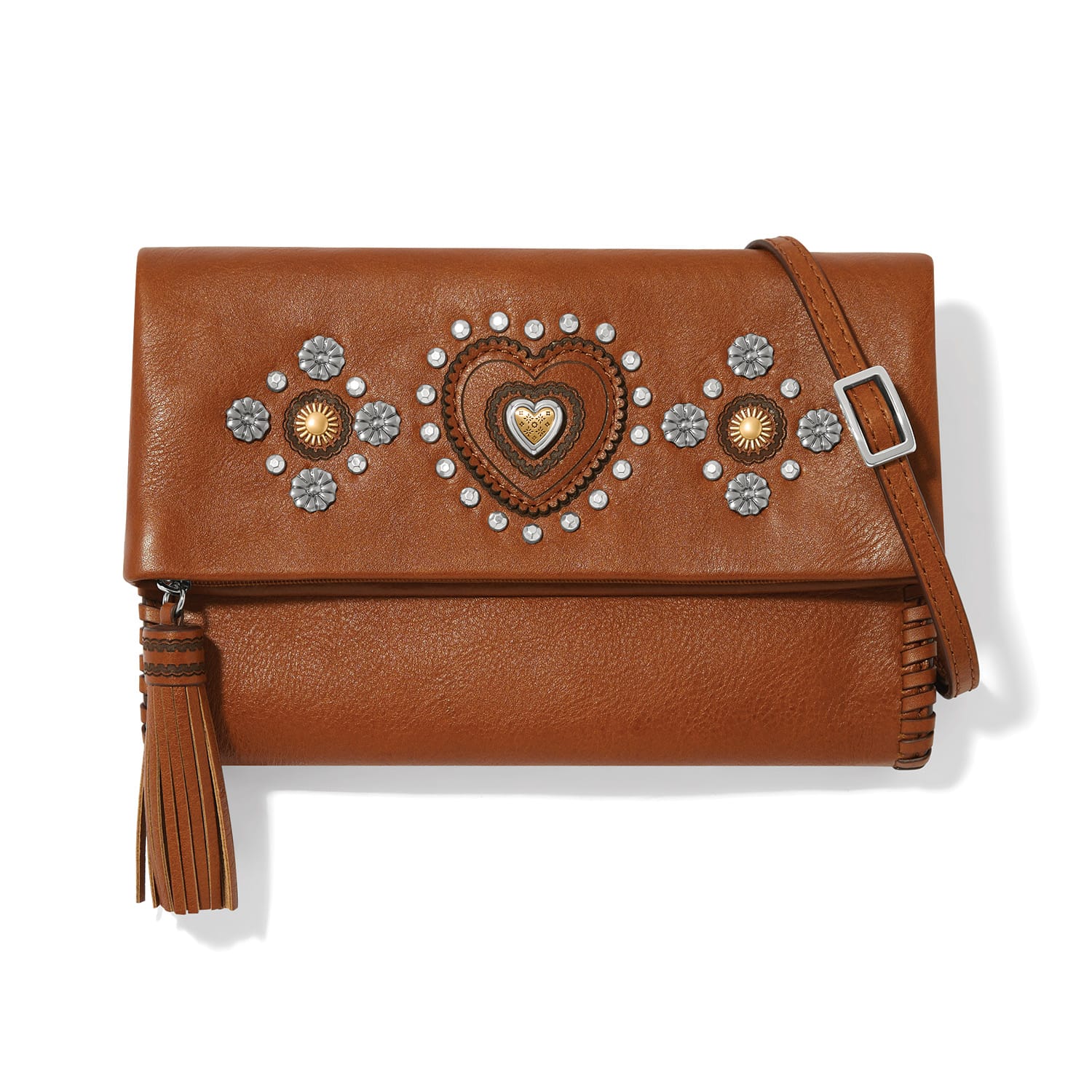 Brighton brown leather crossbody handbag with heart and floral studded accents, tassel, and adjustable strap on a white background