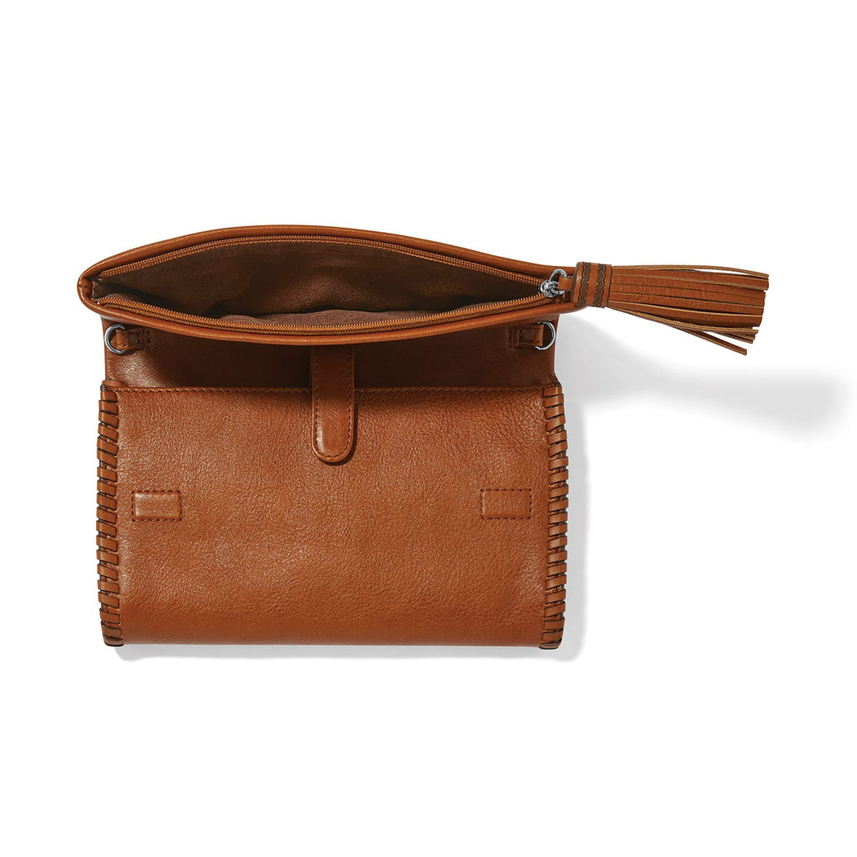 Brighton brown leather handbag shown open with whipstitched sides, leather tassel zipper pull, and suede interior on a white background