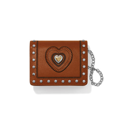 Brighton brown leather card case wallet with heart medallion, studded trim, and silver-tone chain on a white background
