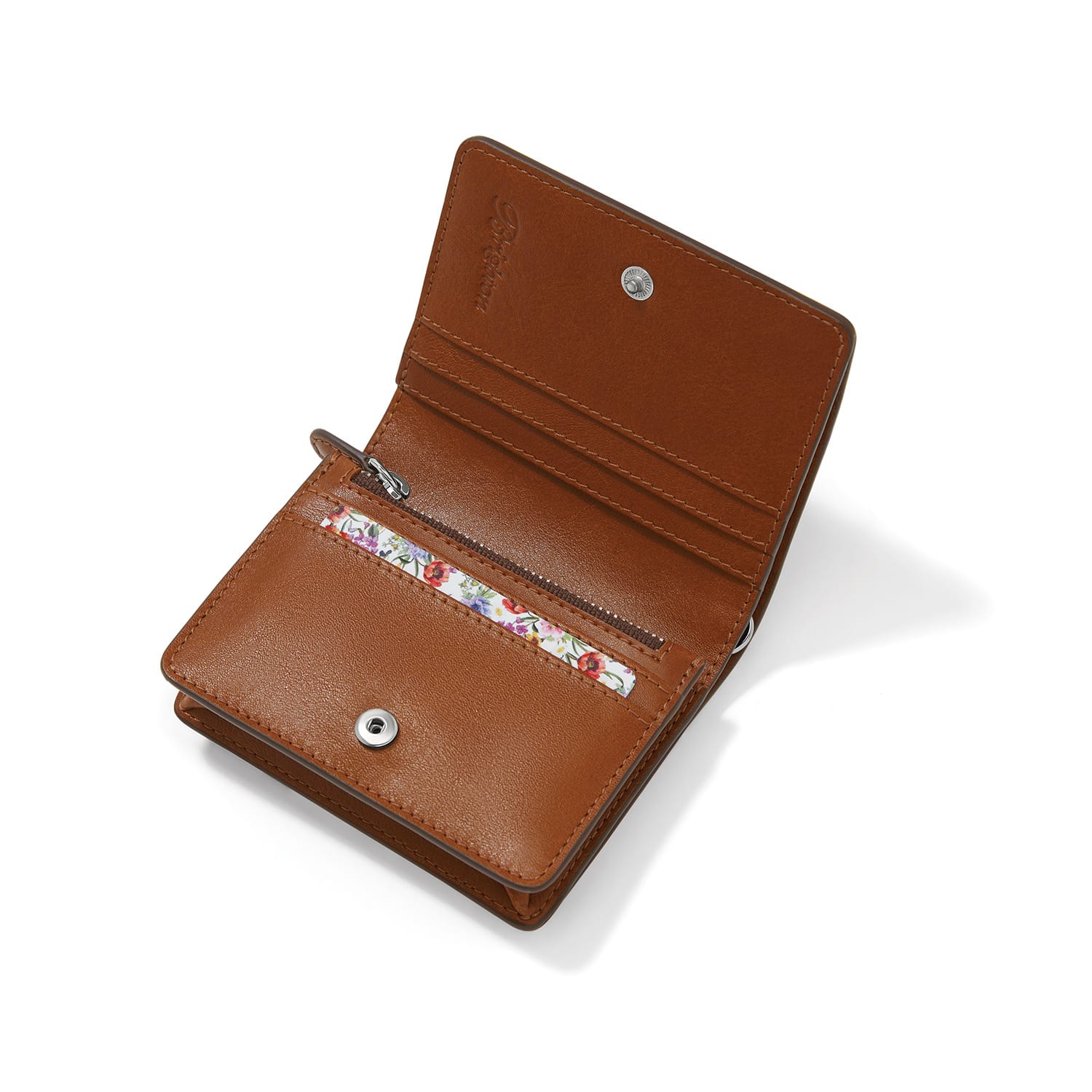 Brighton brown leather wallet shown open with card slots, zippered coin pocket, and floral print interior on a white background