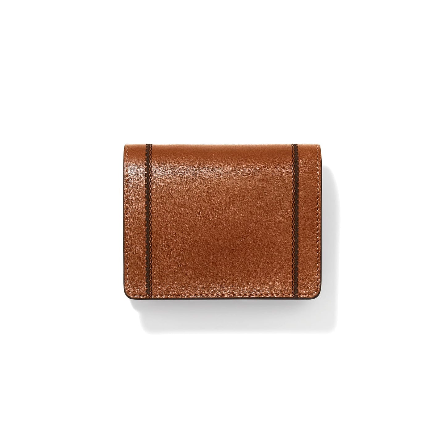 Brighton brown leather bifold wallet with dark vertical stitched accents on front flap on a white background