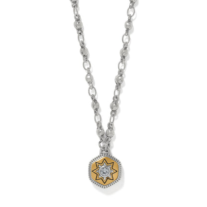 Brighton pendant necklace with two-tone star medallion, crystal center, and silver-tone chain on a white background