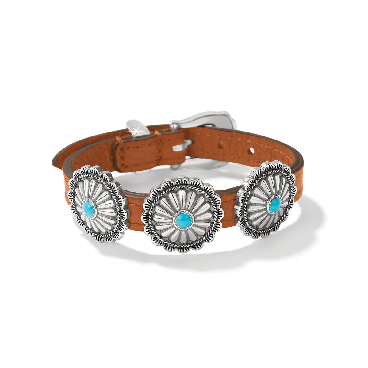 Brighton bracelet with brown leather strap, three silver-plated concho medallions, turquoise stones, and buckle closure on a white background