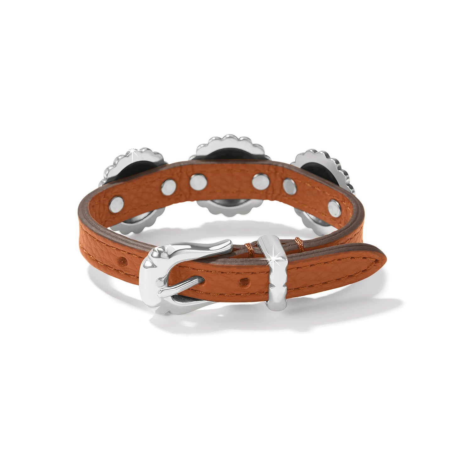 Brighton bracelet with brown leather strap, silver-plated buckle closure, and decorative scalloped conchos on a white background