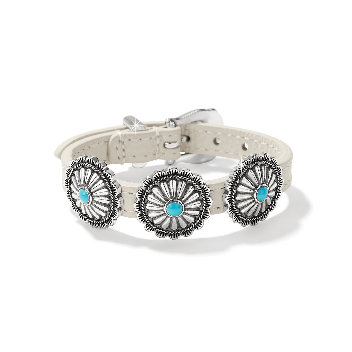 Brighton leather bracelet in cream with three silver-plated concho medallions and turquoise stone centers on a white background