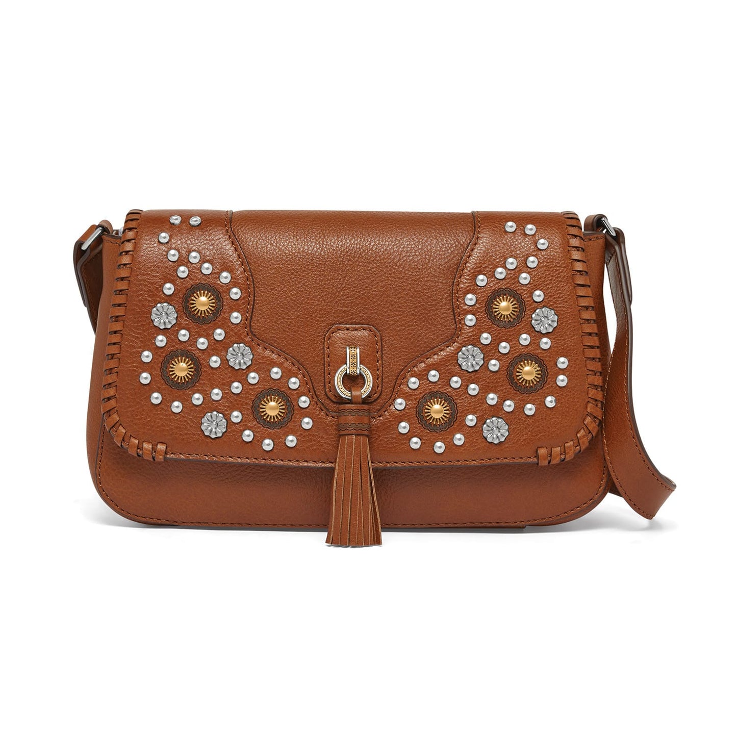 Brighton crossbody handbag in brown leather with floral studs, whipstitch trim, and tassel accent on a white background
