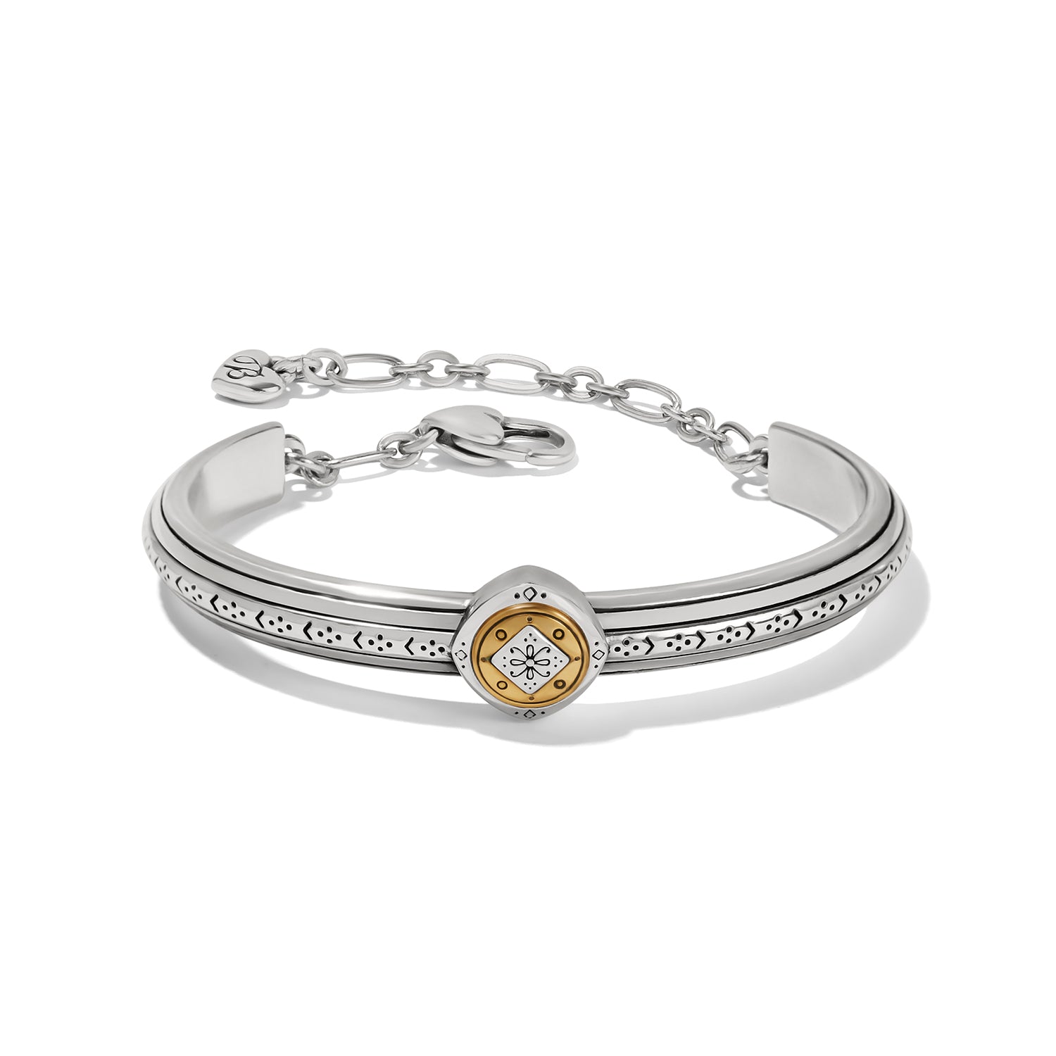 Brighton two-tone cuff bracelet with silver band, etched detailing, gold medallion center, and chain closure on a white background