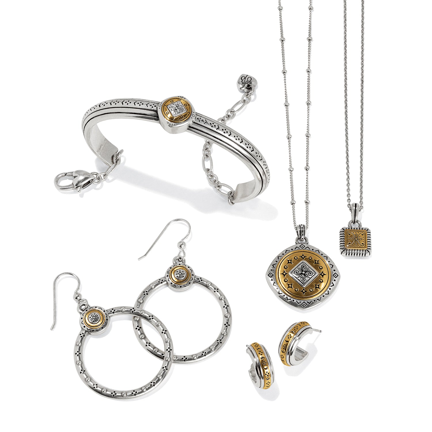 Brighton two-tone jewelry set styled with a bangle bracelet, hoop earrings, and pendant necklaces on white background
