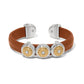Brighton leather cuff bracelet in tan with two-tone medallions and crystal centers on a white background