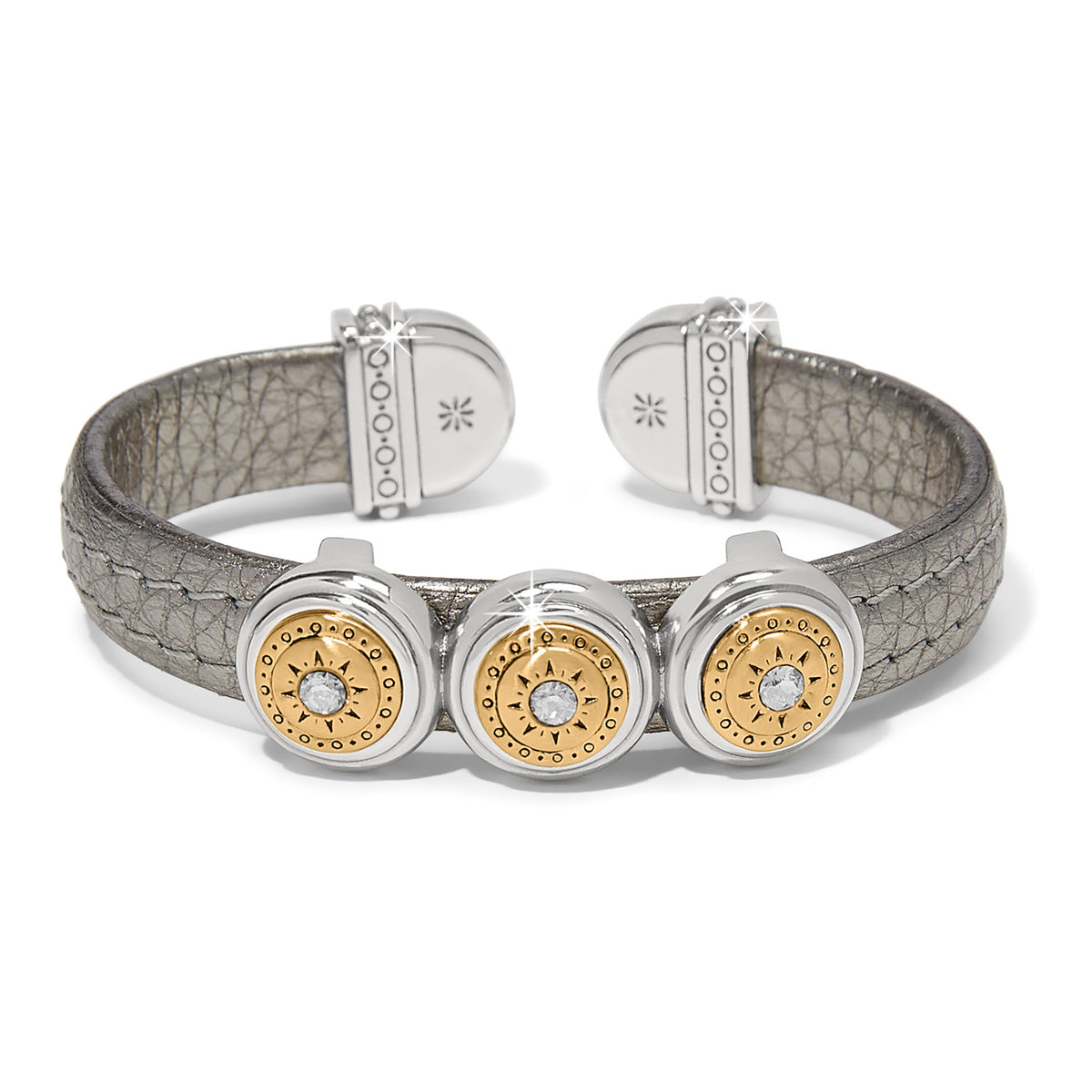 Brighton cuff bracelet with pewter leather band and three two-tone medallions with crystal centers on a white background