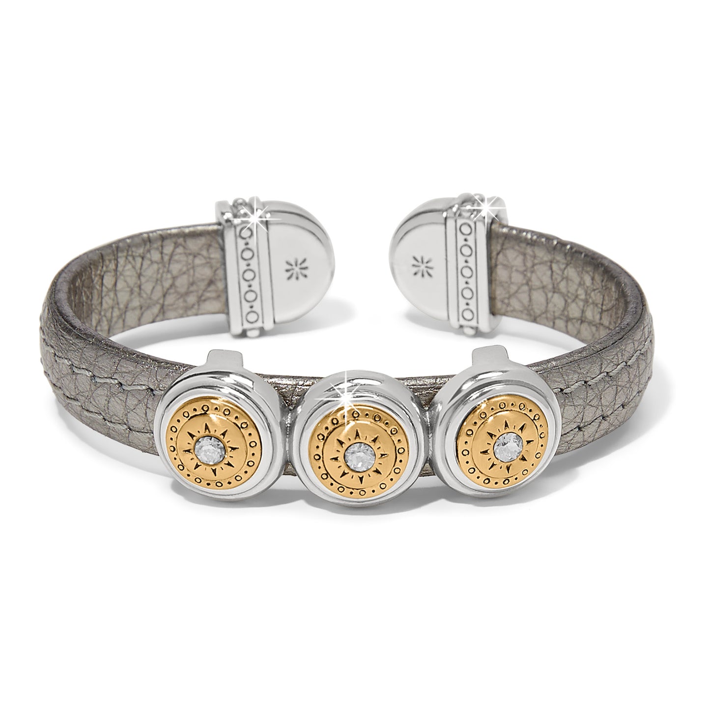 Brighton cuff bracelet with pewter leather band and three two-tone medallions with crystal centers on a white background