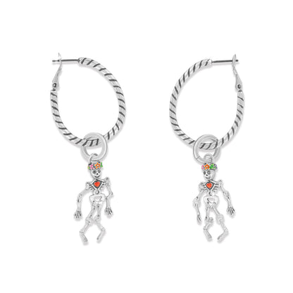 Brighton hoop earrings with silver-plated twisted rope design and dangling enamel skeleton charms on a white background