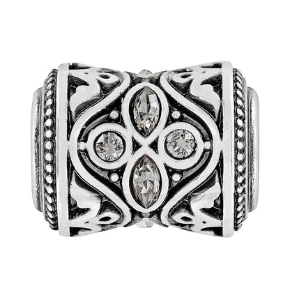 Brighton ring with silver-plated ornate scrollwork band and crystal marquise and round stones on a white background