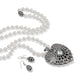 Brighton pearl necklace with silver-plated crystal heart pendant and matching drop earrings on a white background