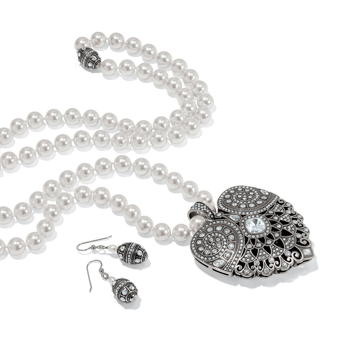 Brighton pearl necklace with silver-plated crystal heart pendant and matching drop earrings on a white background