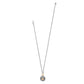 Brighton pendant necklace with two-tone chain and crystal-covered disc featuring gold heart accent on a white background