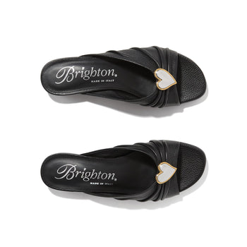 Brighton black leather slide sandals with mother-of-pearl heart accent and gold-tone trim on a white background
