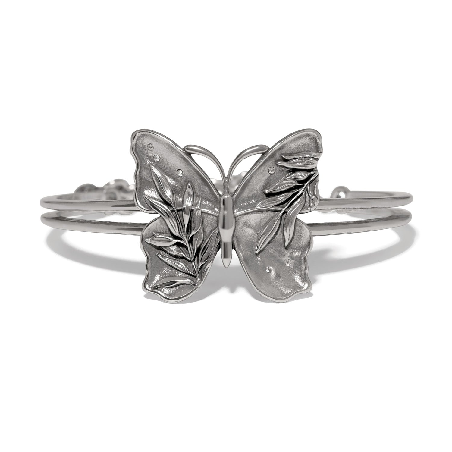 Brighton butterfly cuff bracelet with silver-tone wings, leaf detailing, and crystal accents on a white background