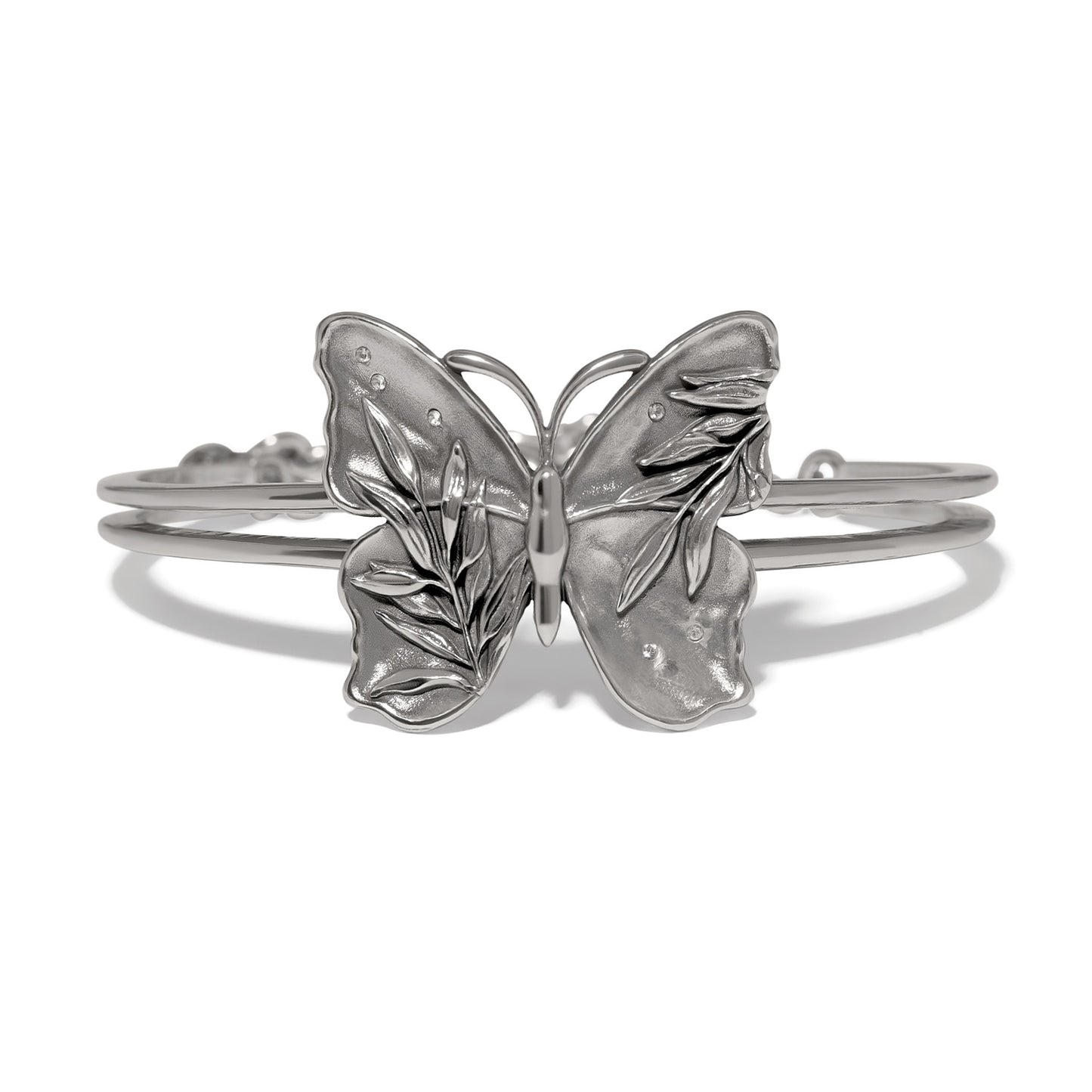 Brighton butterfly cuff bracelet with silver-tone wings, leaf detailing, and crystal accents on a white background