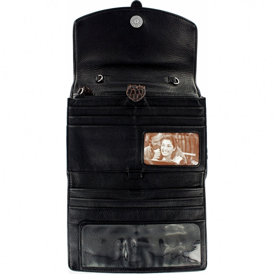 Brighton black leather wallet shown open with card slots, ID window, and clear photo pocket on a white background