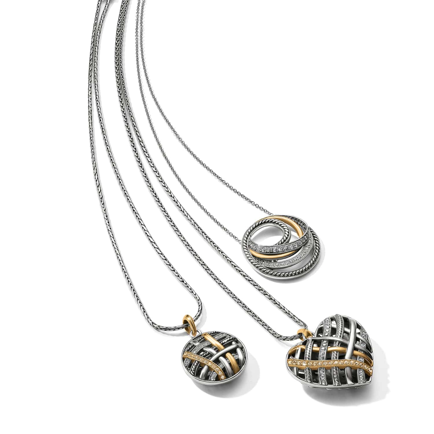 Brighton silver-plated necklaces with woven heart pendant, oval pendant, and interlocking rings with crystals on a white background