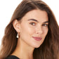 Model wearing a Brighton drop earring with pearl accent, silver-plated and light rose gold-plated finish with crystal detail