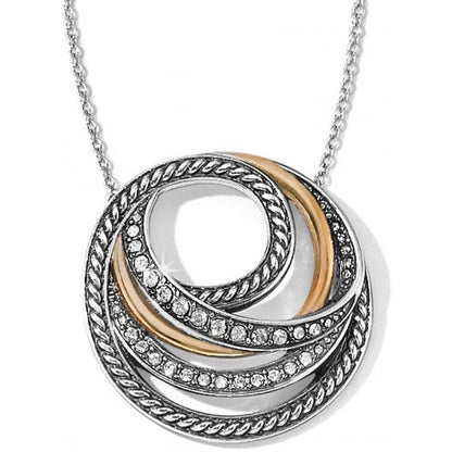 Brighton pendant necklace with silver-plated and gold-tone swirled rings accented with fine quality crystal on a white background