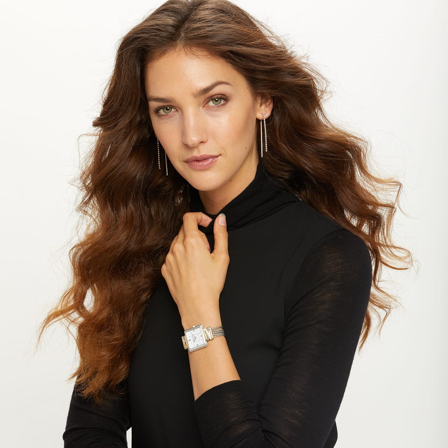 Model wearing a Brighton two-tone rectangular watch with white dial and crystal accents on chain-link bracelet