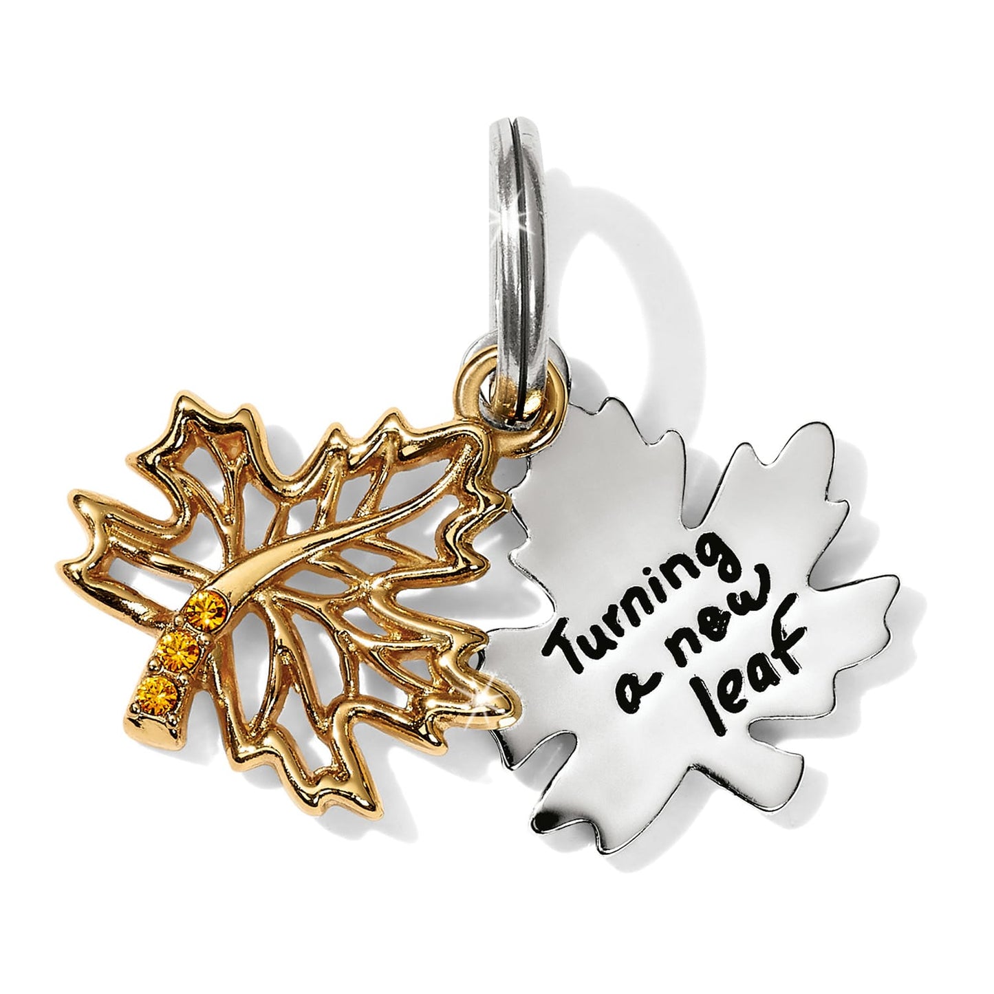 Brighton maple leaf charm in two-tone finish with amber crystals and engraved Turning a new leaf on a white background