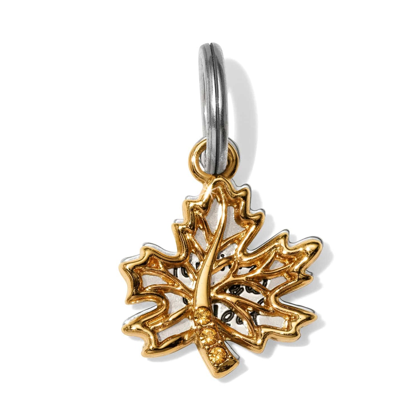 Brighton maple leaf charm shown from the back with two-tone finish and crystal accents on a white background
