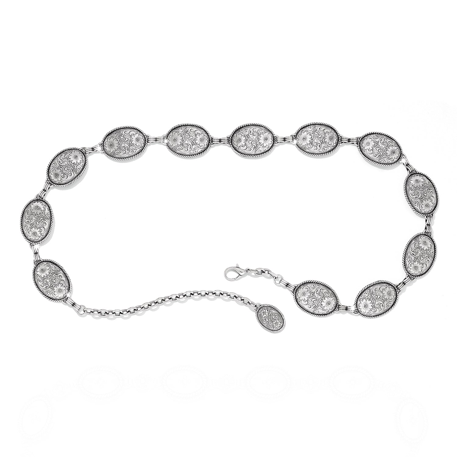 Brighton chain belt with oval engraved silver-tone medallions, floral scroll detail, and lobster clasp closure on a white background