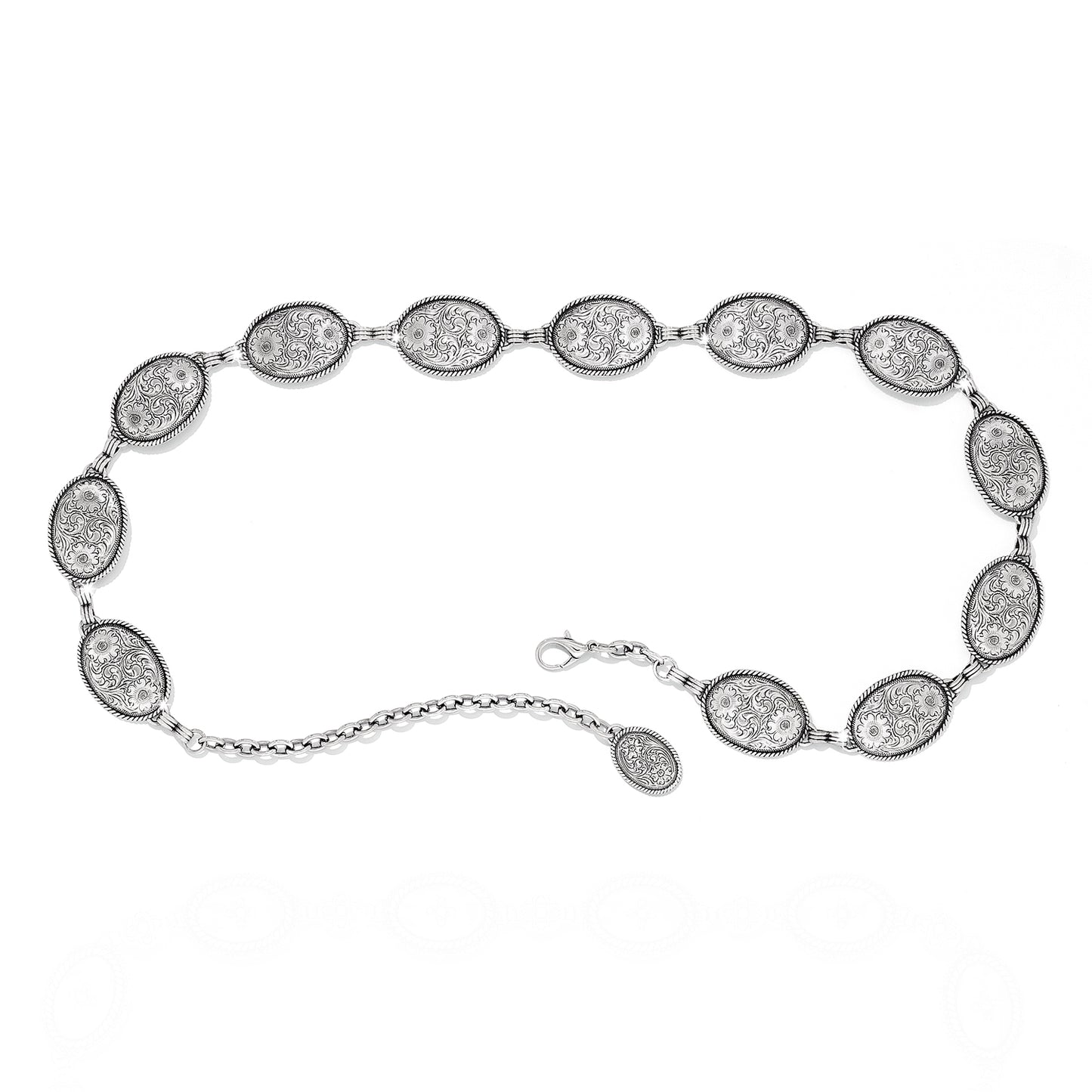 Brighton chain belt with oval engraved silver-tone medallions, floral scroll detail, and lobster clasp closure on a white background