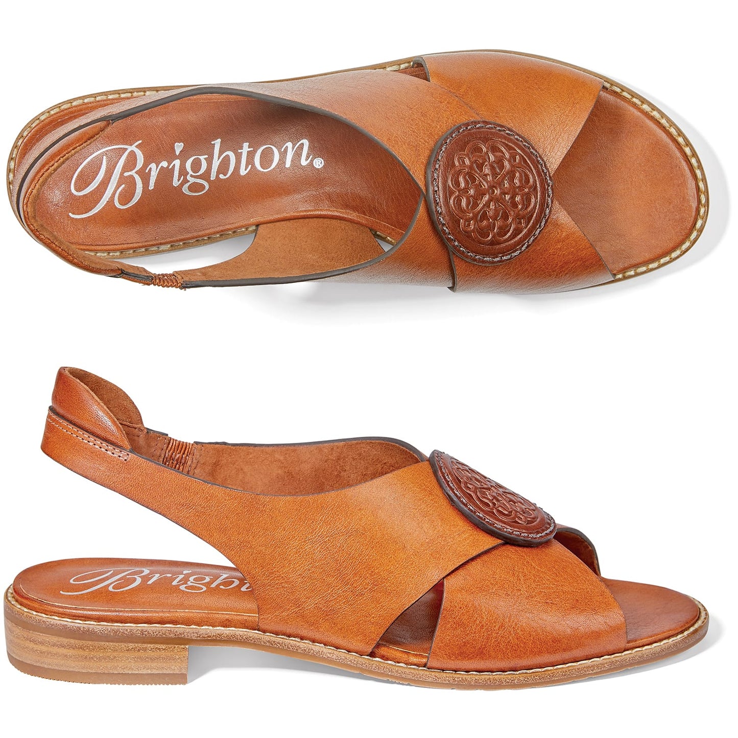 Brighton tan leather crossover sandals with embossed medallion accent and slingback strap, shown from above and side on a white background