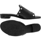 Brighton black leather slide sandals with silver-tone studs and low block heel, shown with sole view, on a white background