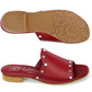 Brighton red leather slide sandals with silver-tone studs, low heel, and patterned sole shown from below on a white background