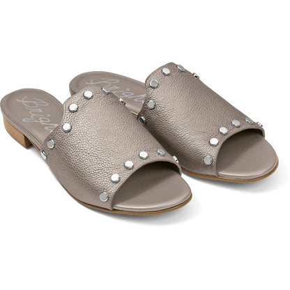 Brighton slide sandals in metallic taupe leather with silver-tone studs and low stacked heel on a white background