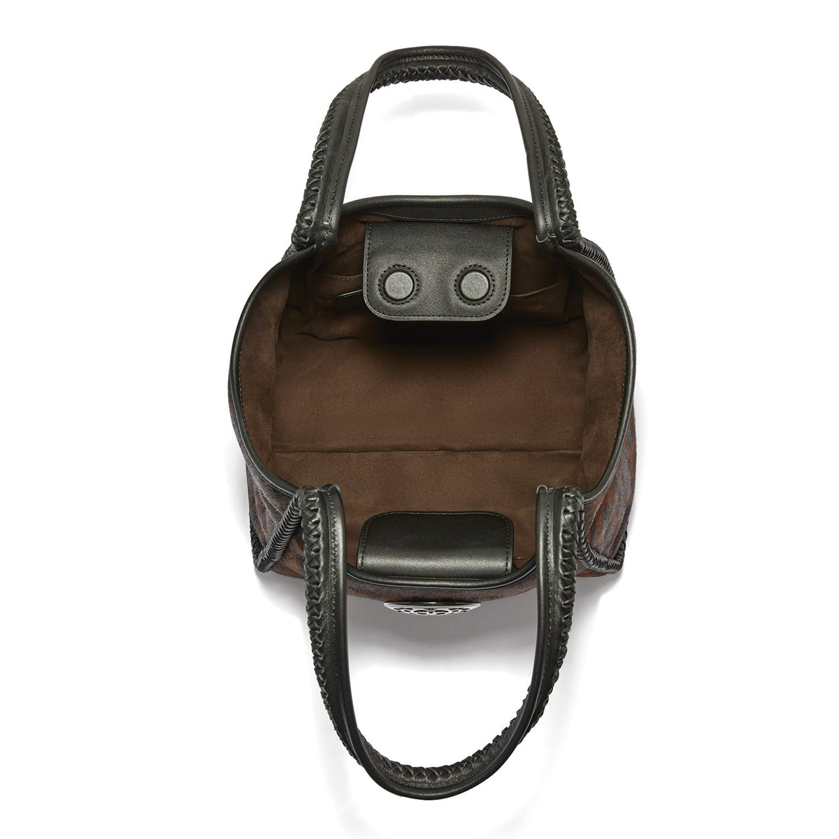 Brighton handbag interior view showing brown suede lining, snap closure tab, and black leather braided handles on a white background