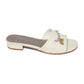 Brighton slide sandal in cream leather with silver-tone chain and gold heart charm accent on a white background