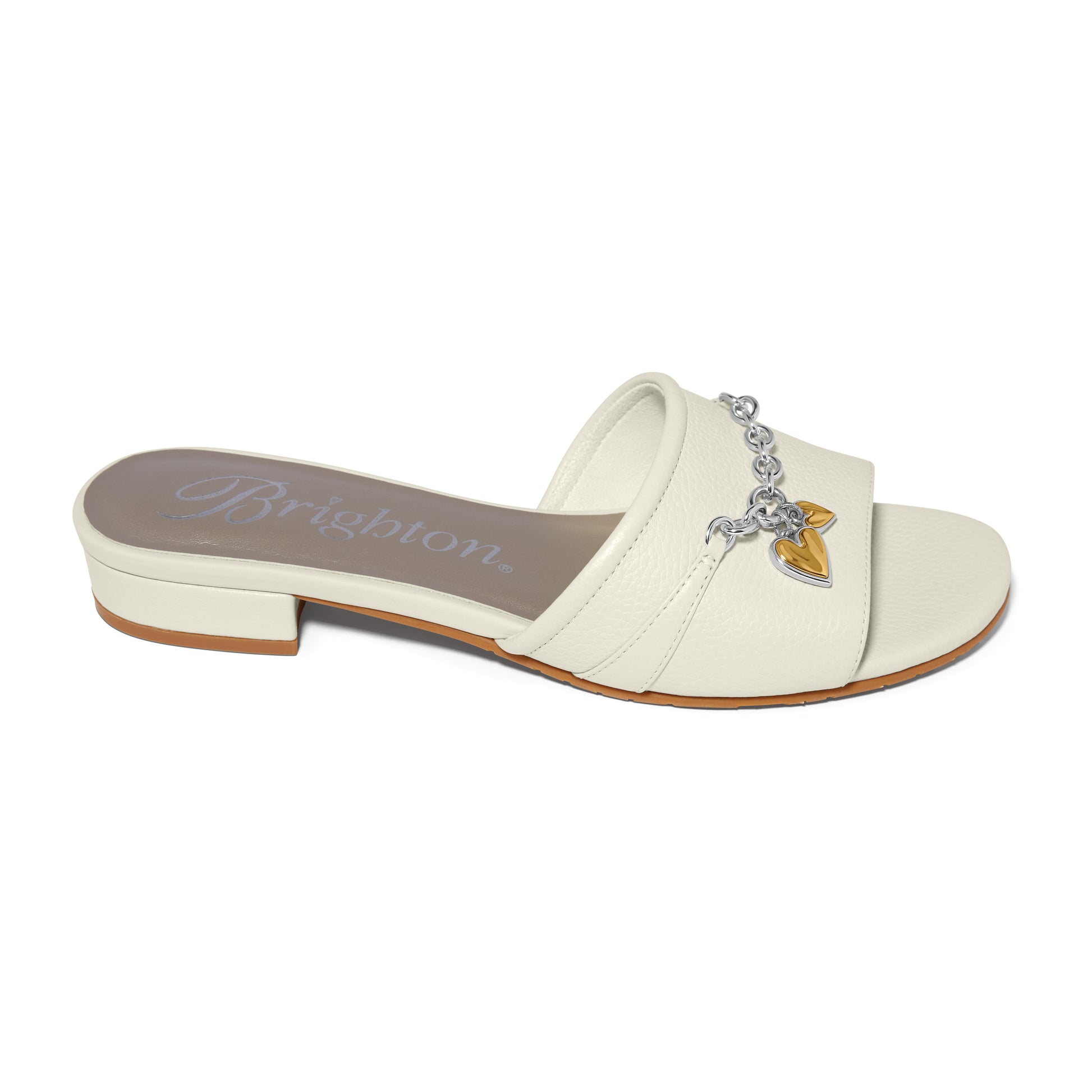 Brighton slide sandal in cream leather with silver-tone chain and gold heart charm accent on a white background