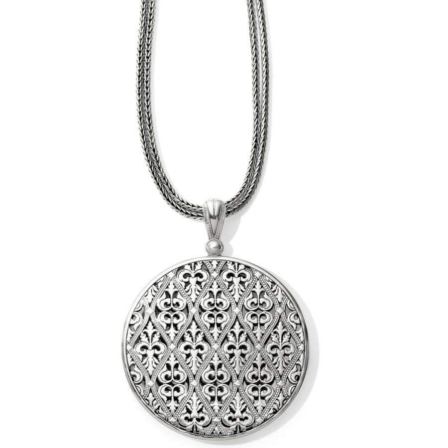 Brighton pendant necklace with round silver-plated medallion featuring intricate fleur-de-lis lattice design and foxtail chain on a white background