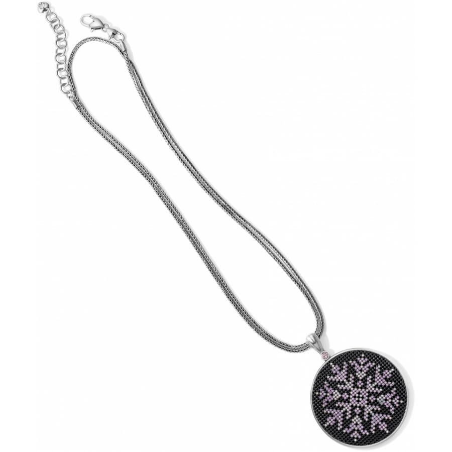 Brighton pendant necklace with silver-plated chain and round black medallion featuring purple crystal starburst on a white background