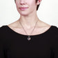 Model wearing a Brighton pendant necklace with silver-plated heart charm featuring American flag crystal design