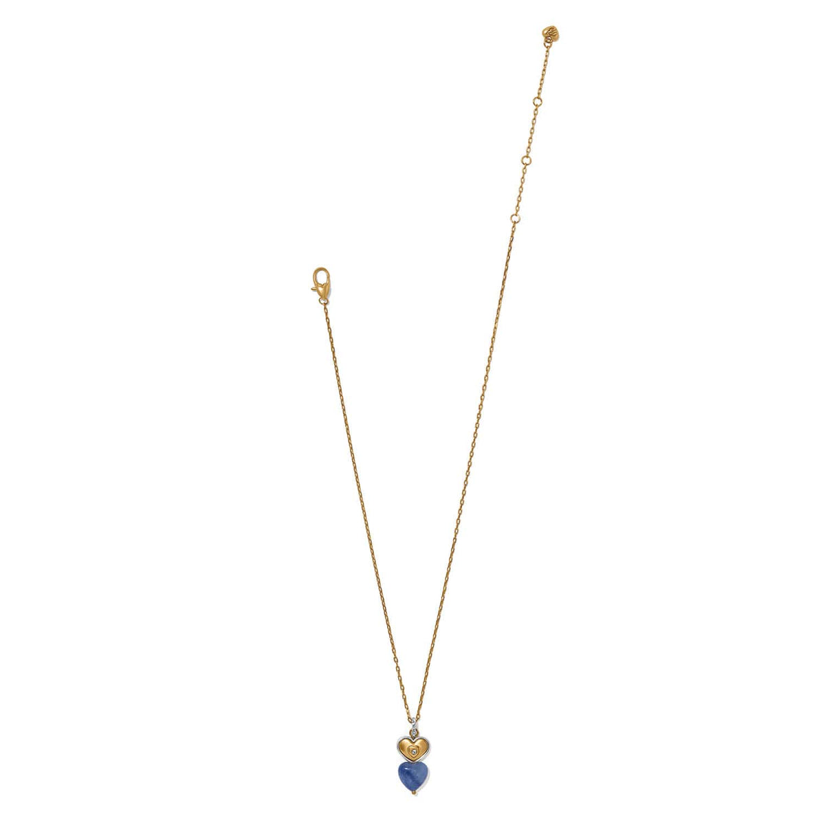 Brighton pendant necklace with two-tone heart charm, blue stone heart drop, and crystal accents on a white background