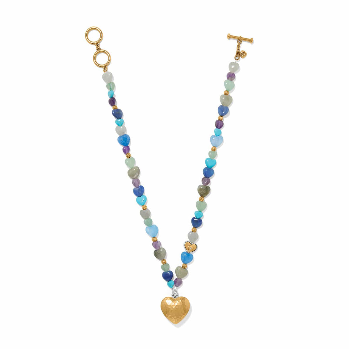 Brighton beaded necklace with multicolor heart stones, gold-plated accents, and hammered gold heart pendant on white background