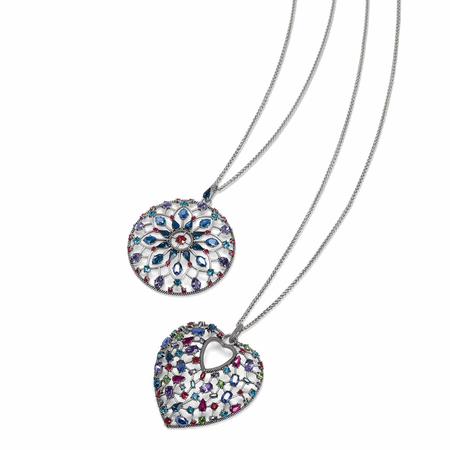 Brighton silver-plated pendant necklaces with circular medallion and heart designs featuring multicolored crystals on a white background