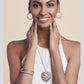 Model wearing a Brighton silver-plated heart pendant necklace with multicolored crystals and coordinating Brighton accessories