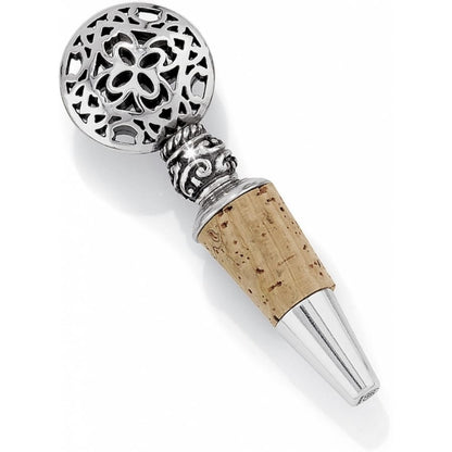 Brighton bottle stopper with silver-plated openwork medallion top, ornate scrollwork, and natural cork tip on a white background