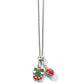 Brighton charm necklace with silver-plated chain, enamel gift box and ornament charms with red and green crystals on a white background