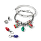Brighton silver-plated bracelets styled with enamel Christmas light charms and crystal spacer beads on a white background