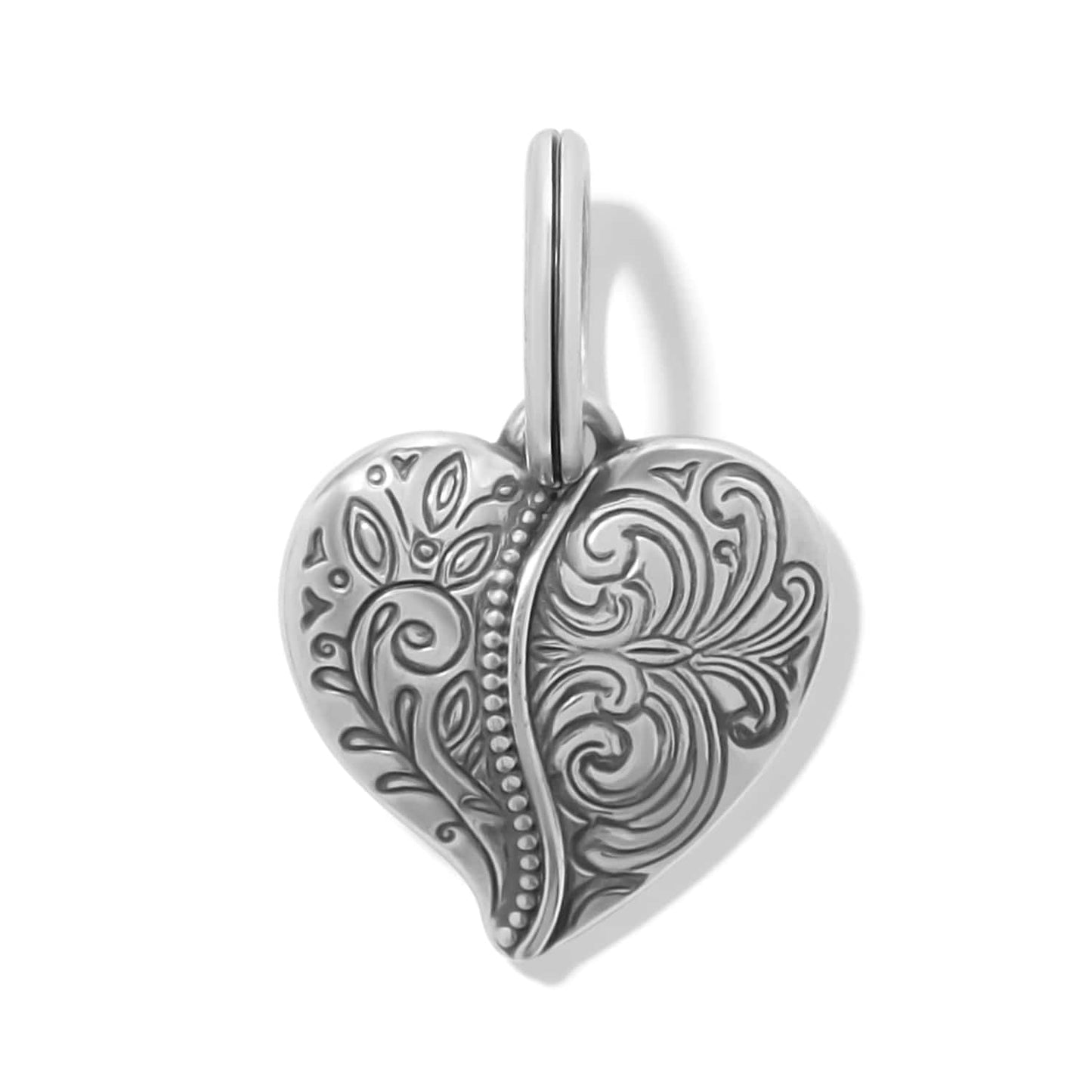 Brighton heart charm with silver-plated ornate scroll and leaf engravings and split ring on a white background